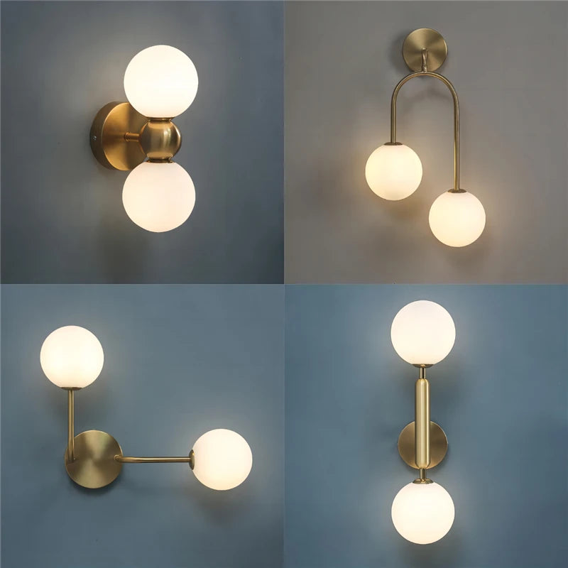 Four different wall lights with gold fixtures and white glass shades on a gradient background.