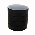 Black cylindrical container with a gray lid on a white background