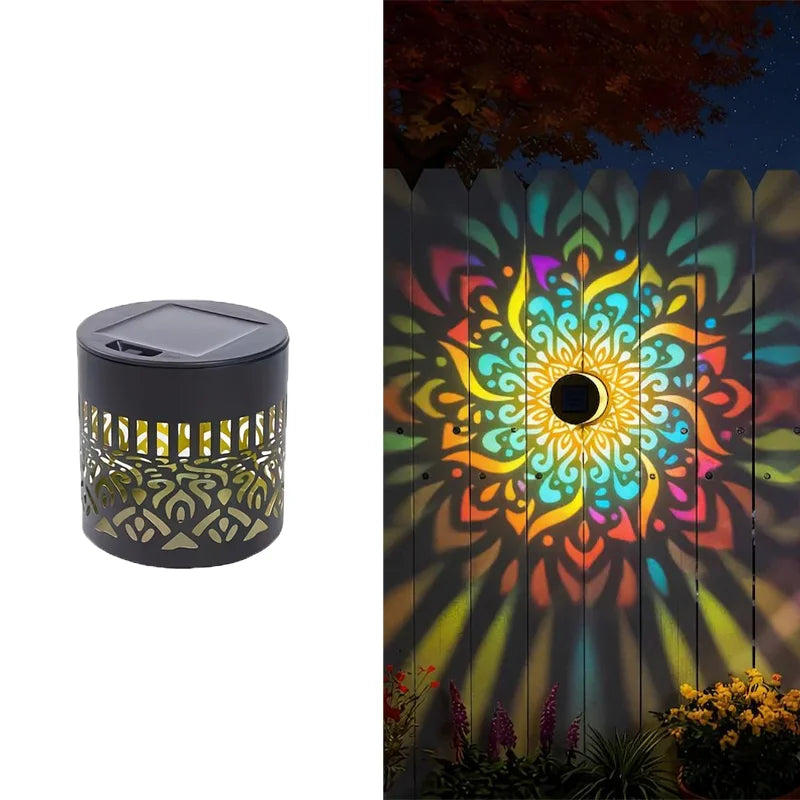 Solar-powered outdoor light with colorful geometric pattern projected onto a wall.