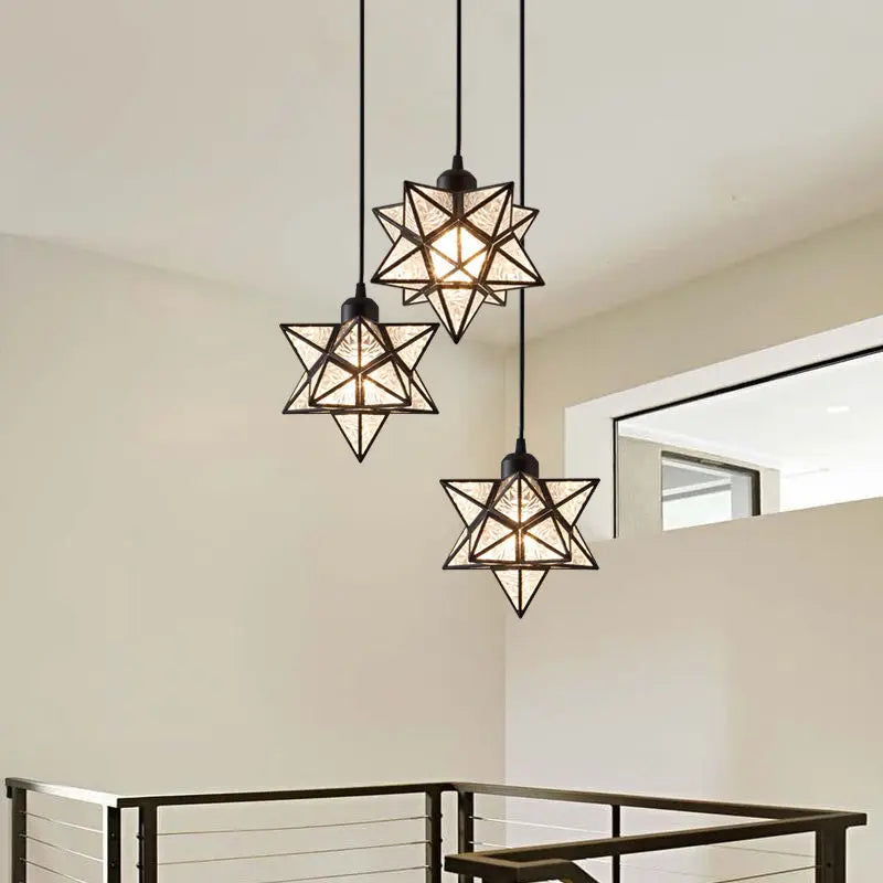 Geometric pendant lights hanging in a modern interior setting.