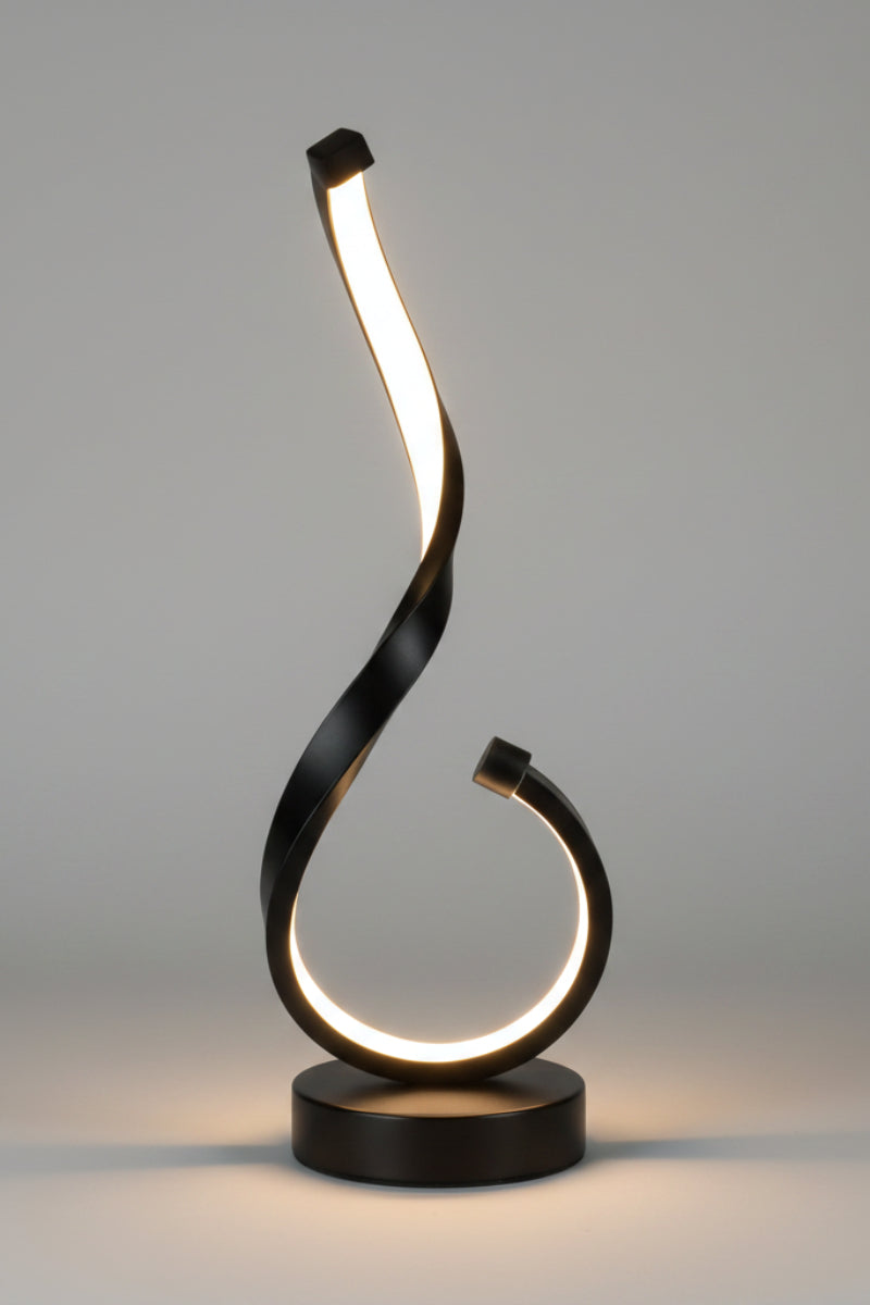 Black metal sculpture with a curved design on a white background