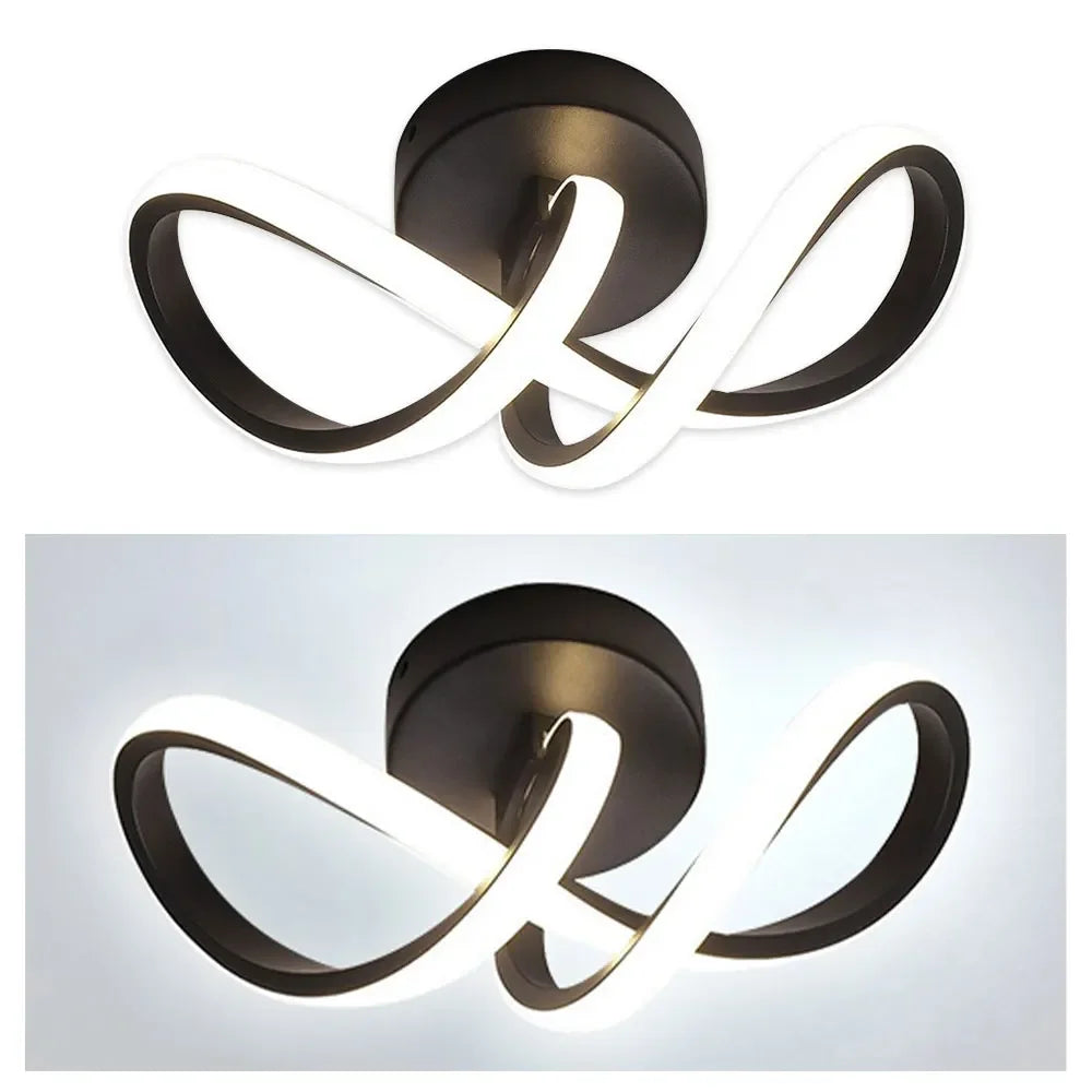 Modern ceiling light fixture with black and white design on a white background
