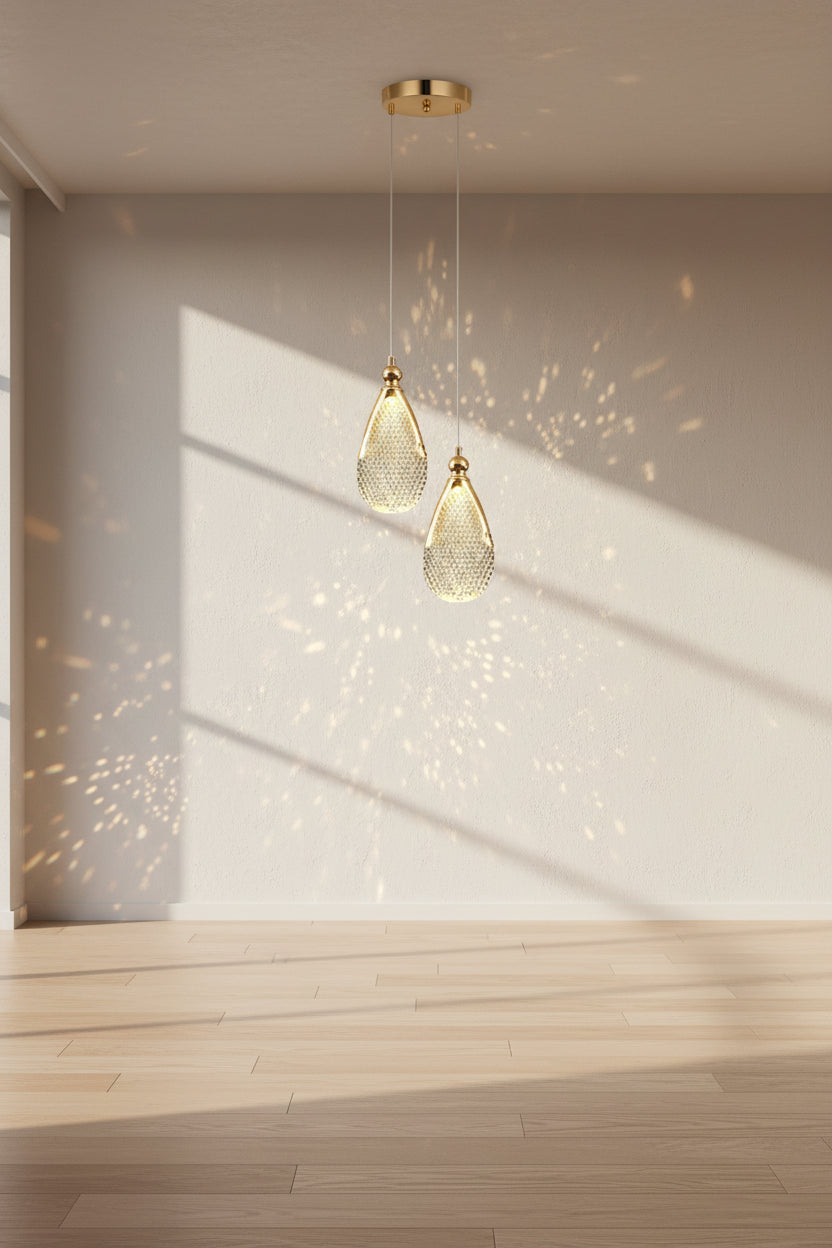 Gold pendant light fixture with measurements on a dark background