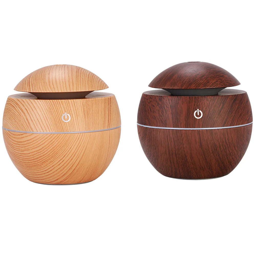 Two wooden diffusers, one light brown and one dark brown, on a white background.