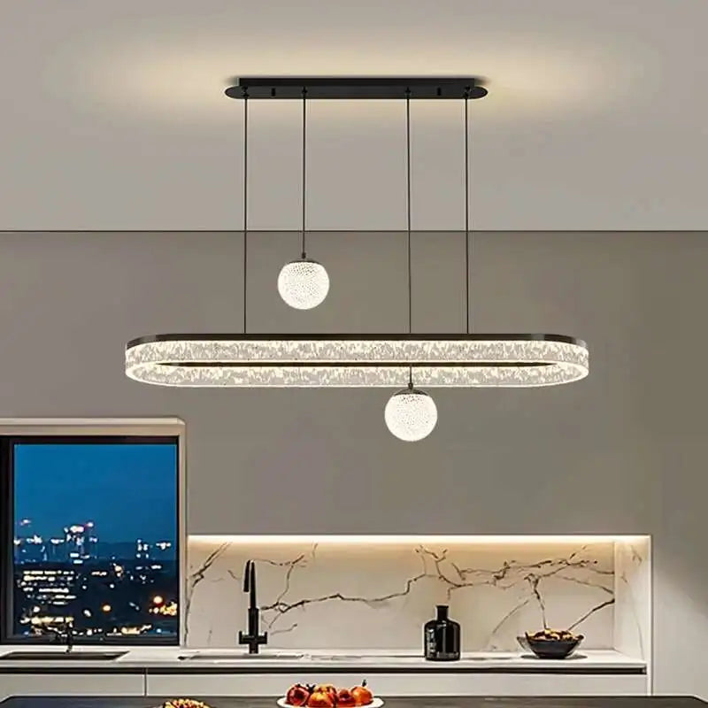 Modern kitchen with a stylish pendant light fixture.