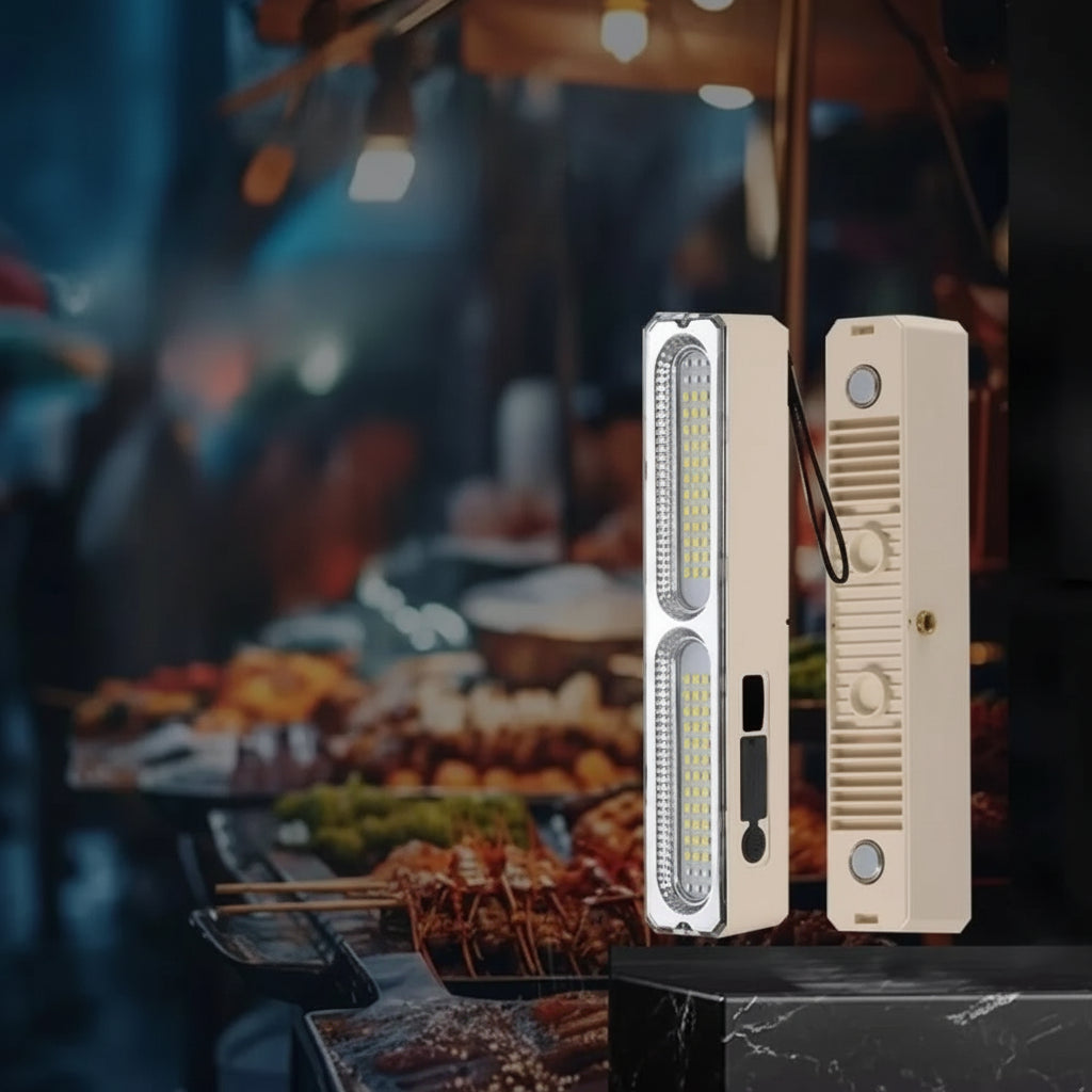 LED multifunctional stall light with charging cable on a blurred outdoor camping background