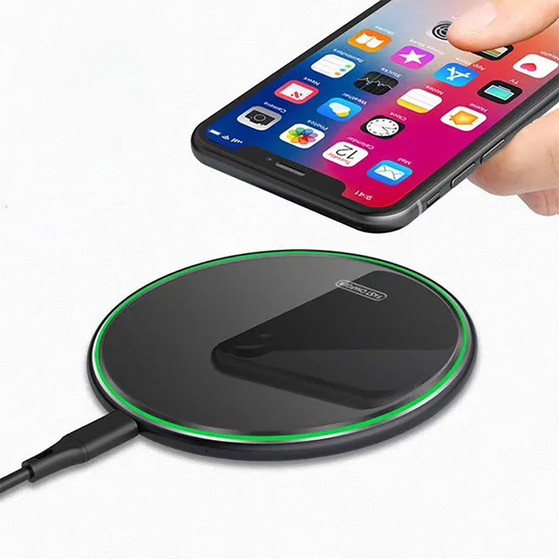 Wireless charging pad with a smartphone on a white background