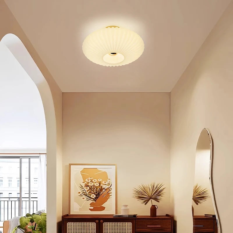 Ceiling light fixture in a room with decor elements