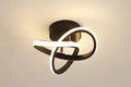 Ceiling light fixture with black and white design on a beige background