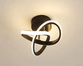 Ceiling light fixture with black and white design on a beige background
