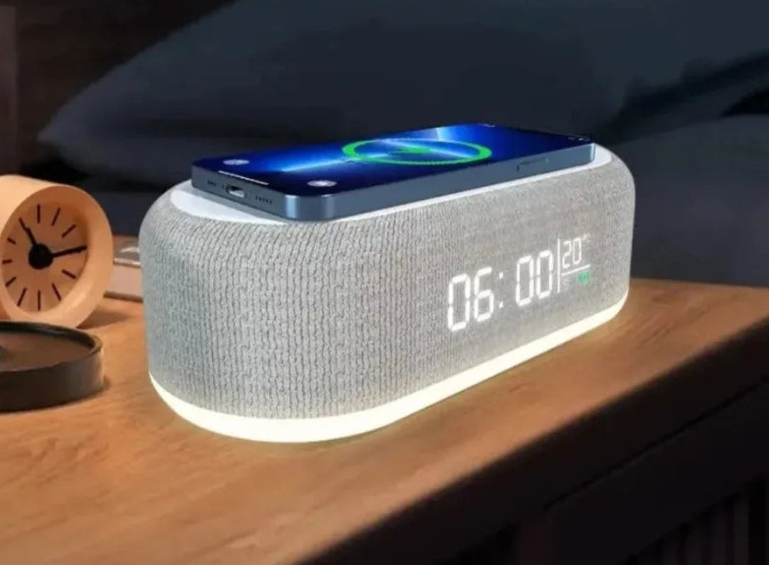 Multifunctional device with alarm clock, temperature display, wireless charger, and night light on a wooden surface.