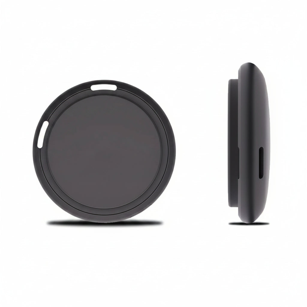 Black circular object with a textured surface on a white background