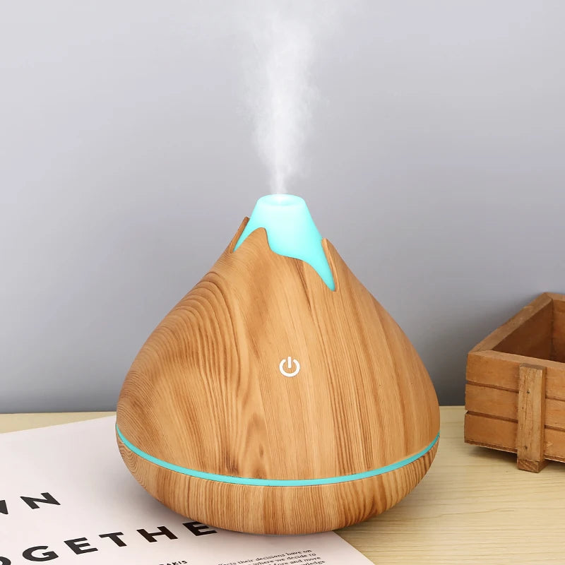 Wooden-patterned diffuser with a power symbol on a light surface