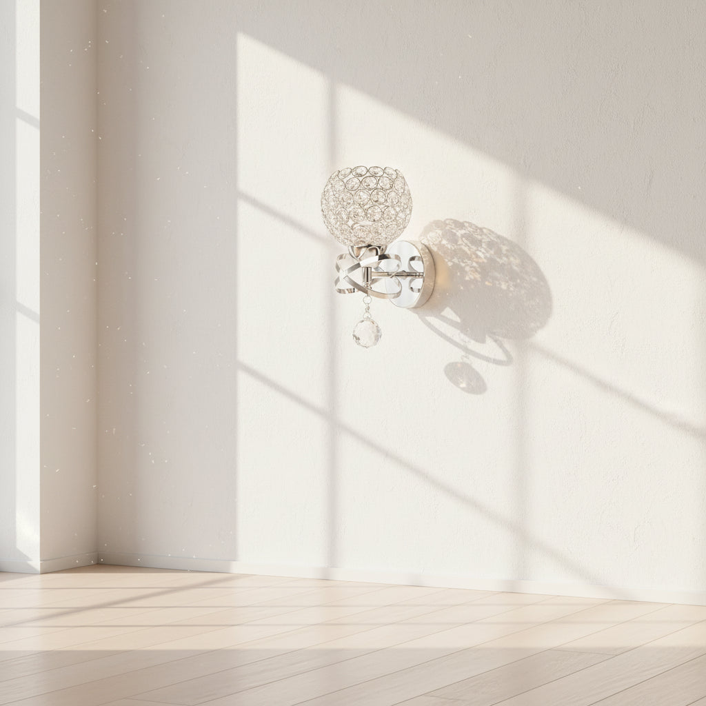 Chrome wall sconce with crystal ball design on a white background