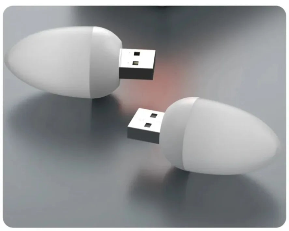 Two USB drives on a reflective surface with a gray background