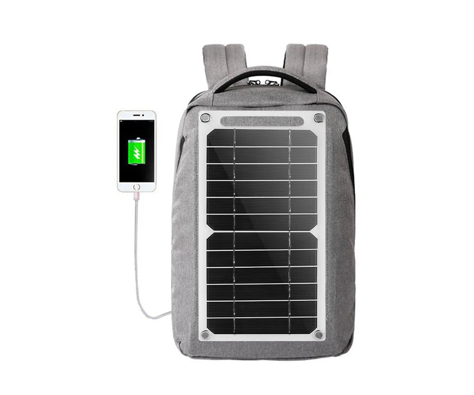 Gray backpack with solar panel and smartphone charging on a white background