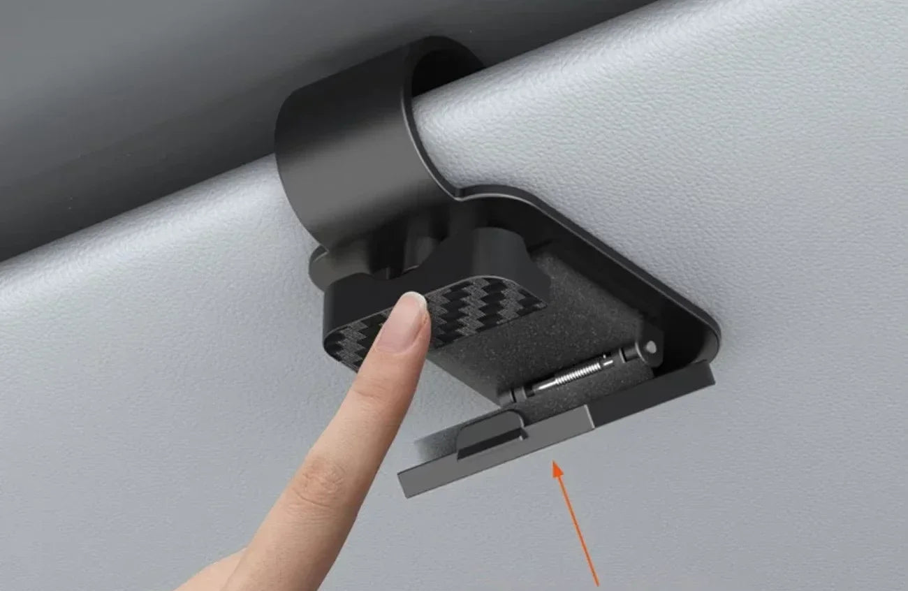Car sun visor with one-hand operation feature, showing a hand pressing and releasing it.