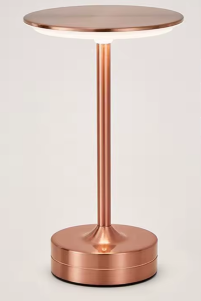 Copper side table with a cylindrical design on a light background