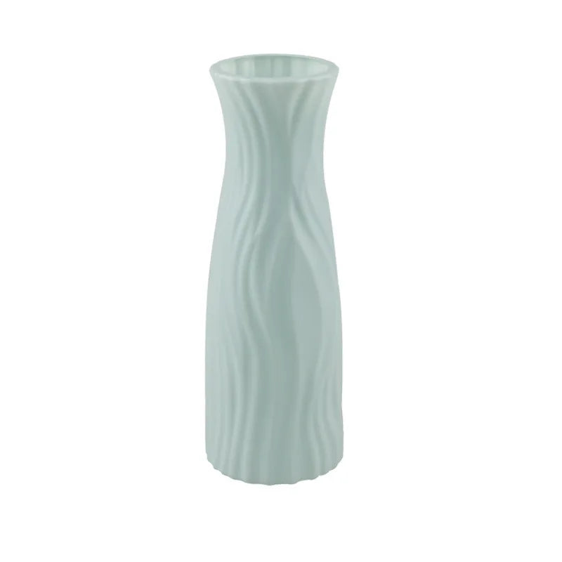 Light blue textured vase on a white background