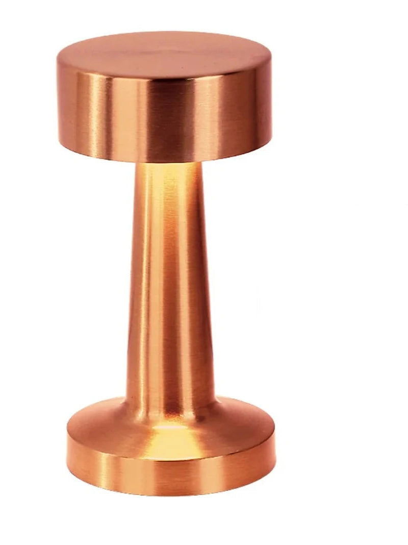 Copper-colored USB rechargeable tricolor light on a white background