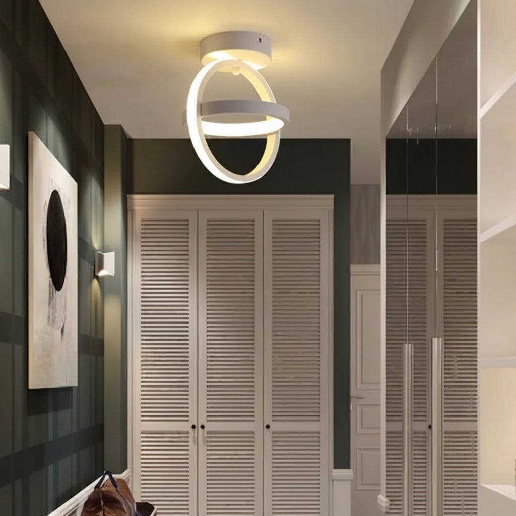 Modern ceiling light fixture in a room with wooden shutters and minimal decor.