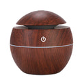 Wooden-textured humidifier with power symbol on a white background