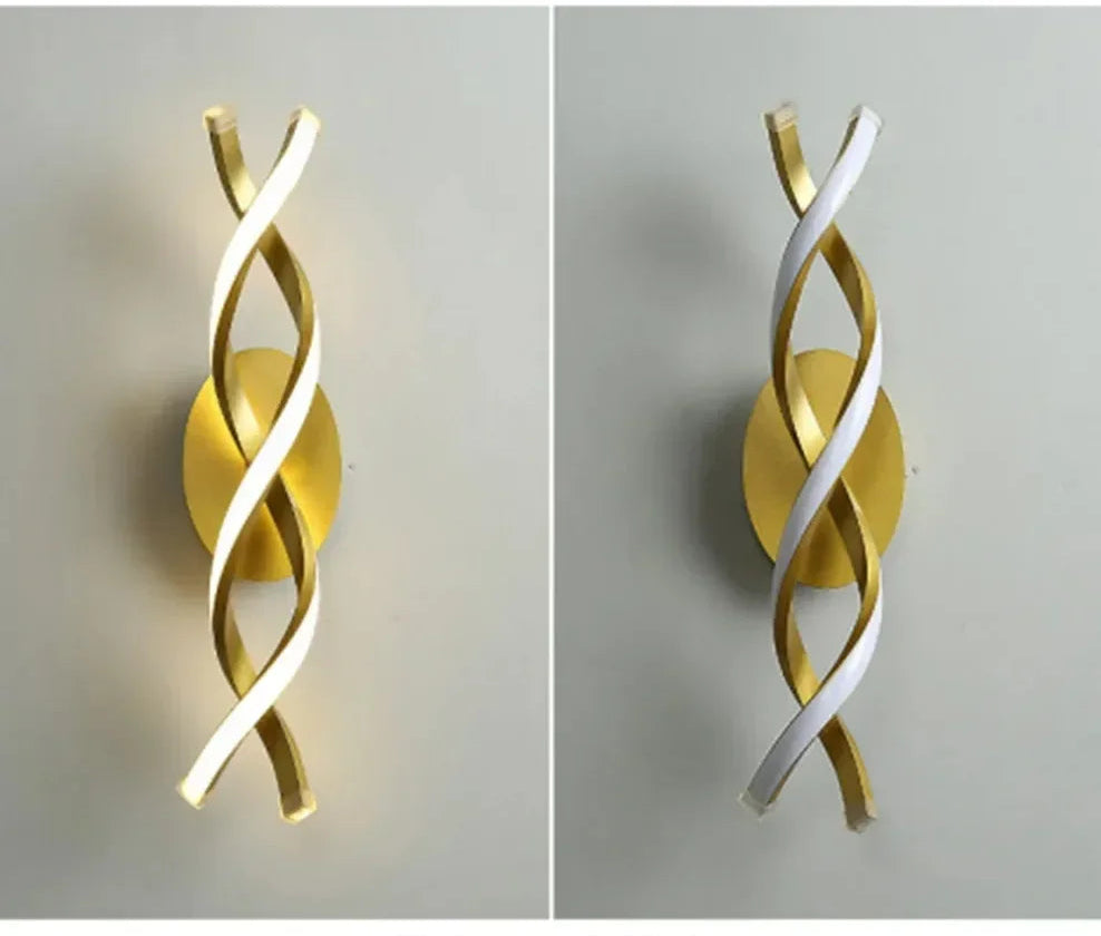 Two wall sconces, one gold and one white, on a neutral background.