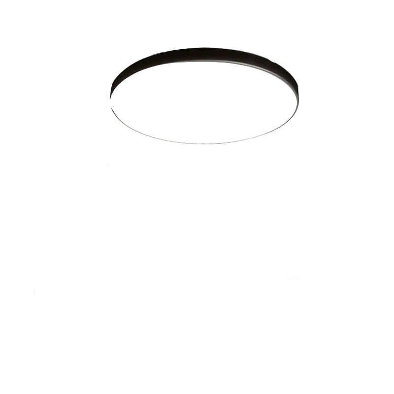 Black circular ceiling light fixture on a white background