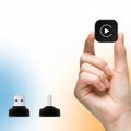 Hand holding a small device with 'MINI Apple CarPlay' text and icons for wired CarPlay and Android Auto.