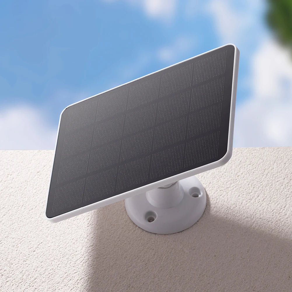 Solar panel attached to a wall with a clear blue sky background