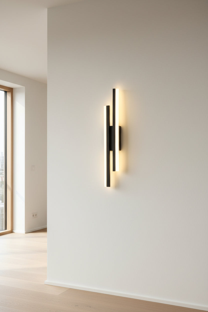 Modern wall lamp with black finish on a plain wall, featuring text detailing dimensions and features.
